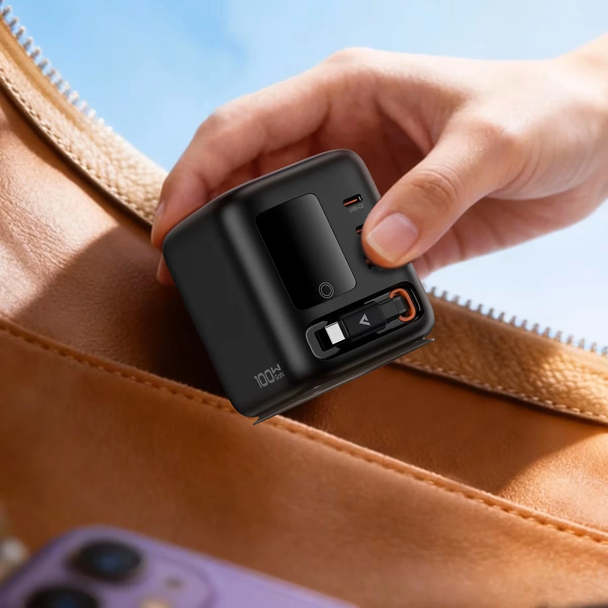 The Acefast Z10 is a 100W - GaN desktop power station featuring a smart color display and four fast-charging outputs, including multiple USB-C and USB-A ports alongside a built-in retractable flexible cable - Image 1